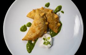 Seviche Louisville signature dishes  Various types of Seviche (e.g., Classic, Tuna, Shrimp), Gaucho Steak, Seafood Paella, Empanadas, Avocado Ice Cream.